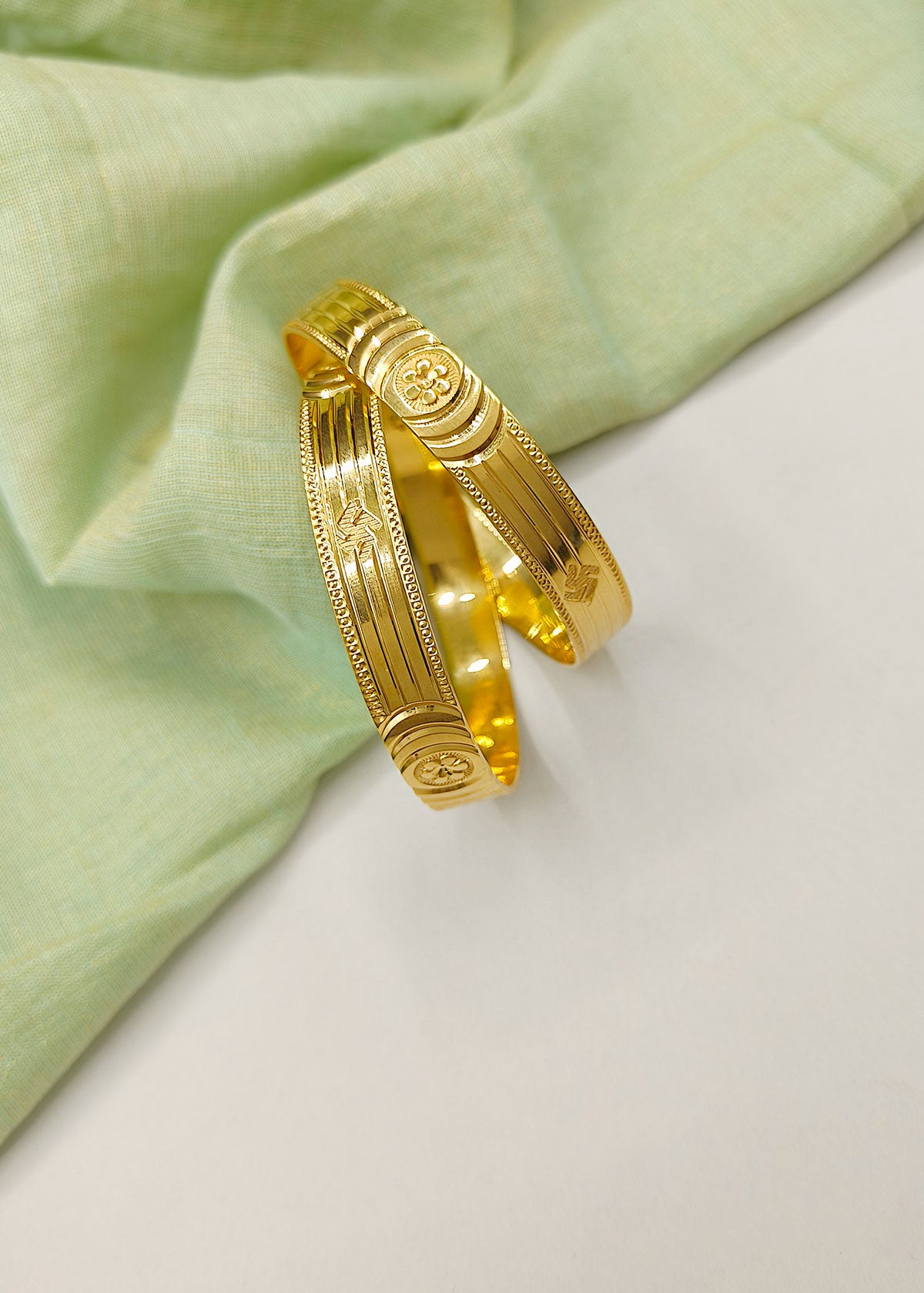 Floral and Swastik Design Carved Glossy 1 Gram Gold Plated Bangles (Pair)