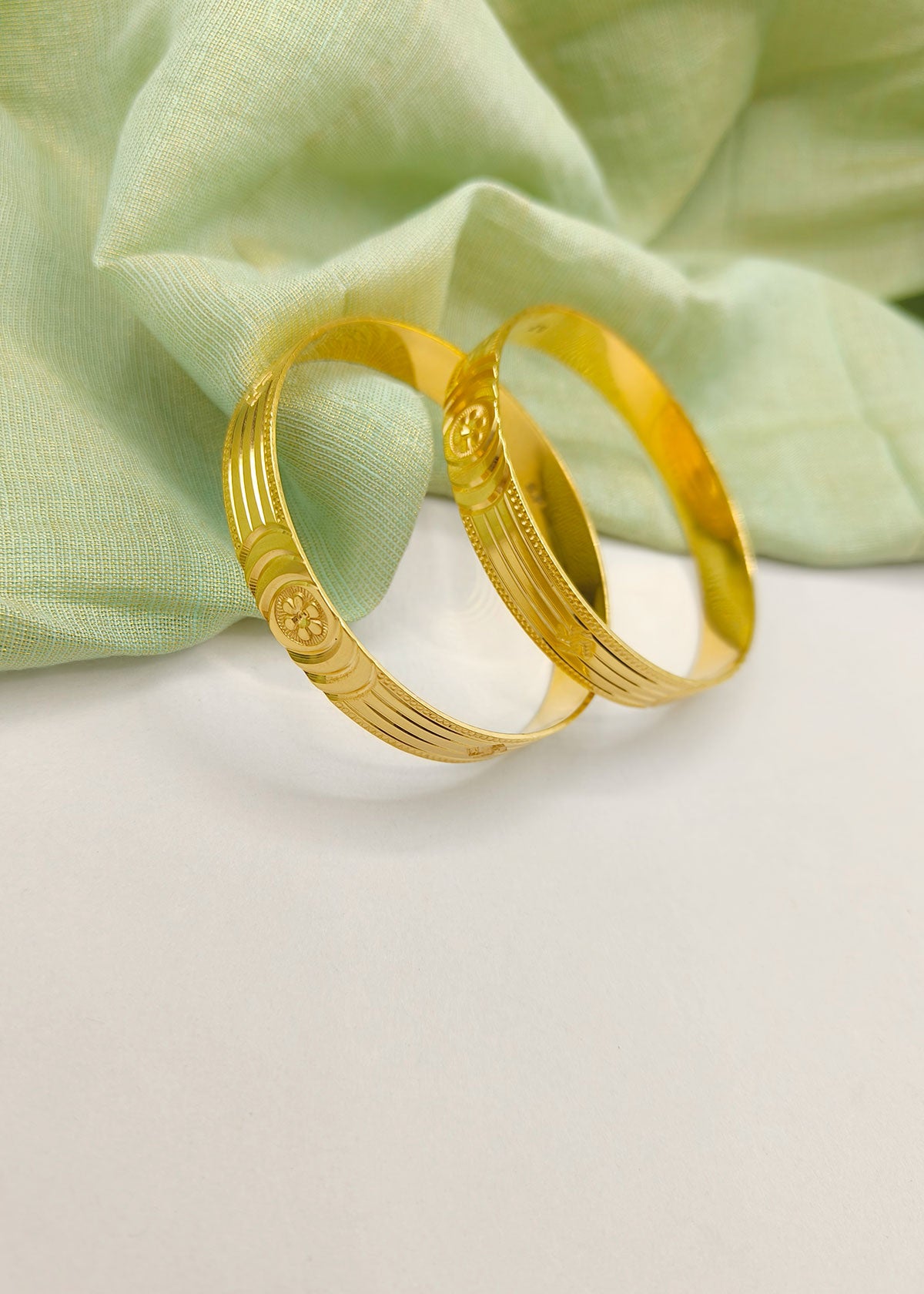 Floral and Swastik Design Carved Glossy 1 Gram Gold Plated Bangles (Pair)