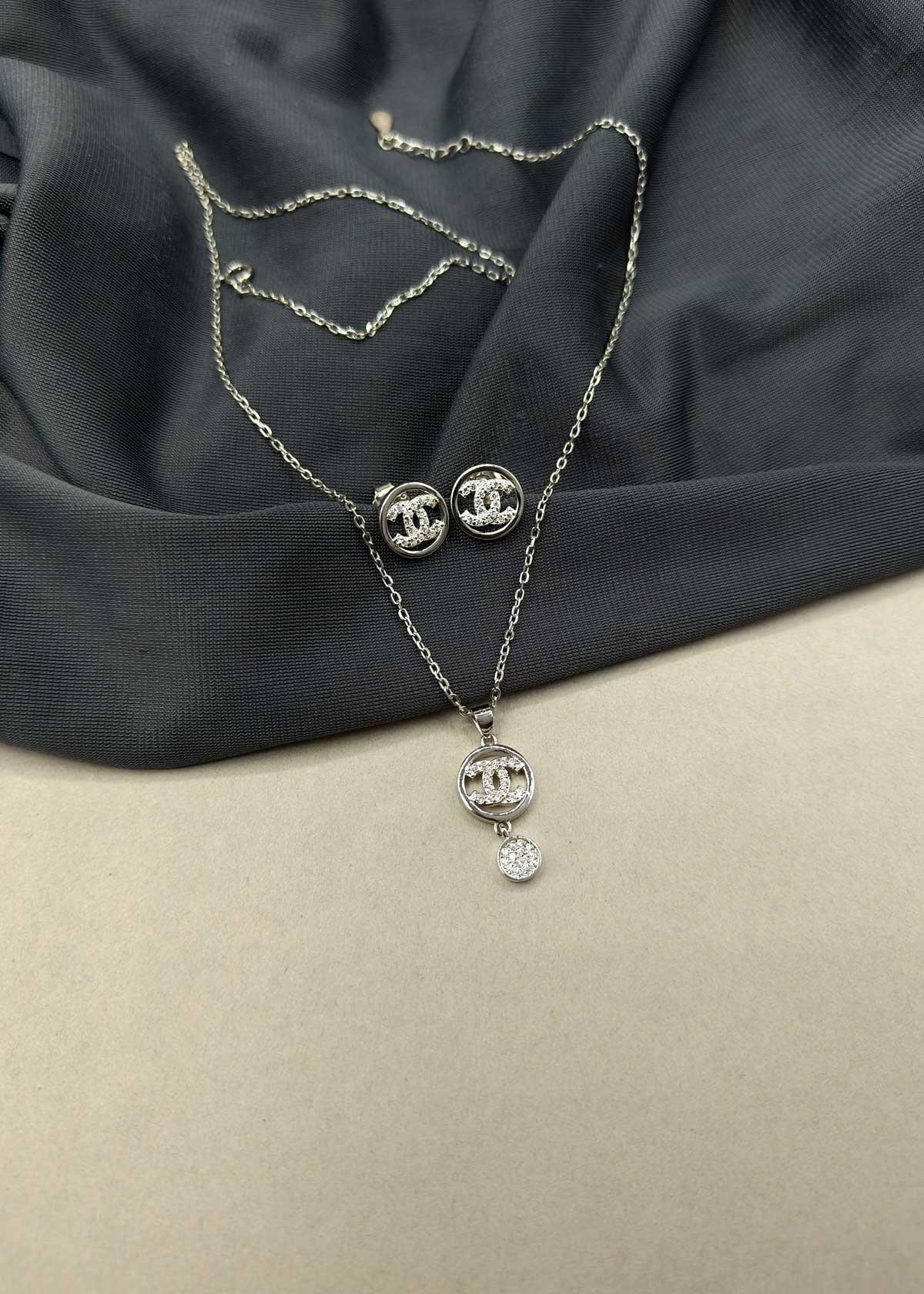 92.5 Sterling Silver Chanel Inspired With Cubic Zircon Stone Round Design Pendant Set With Chain For Women