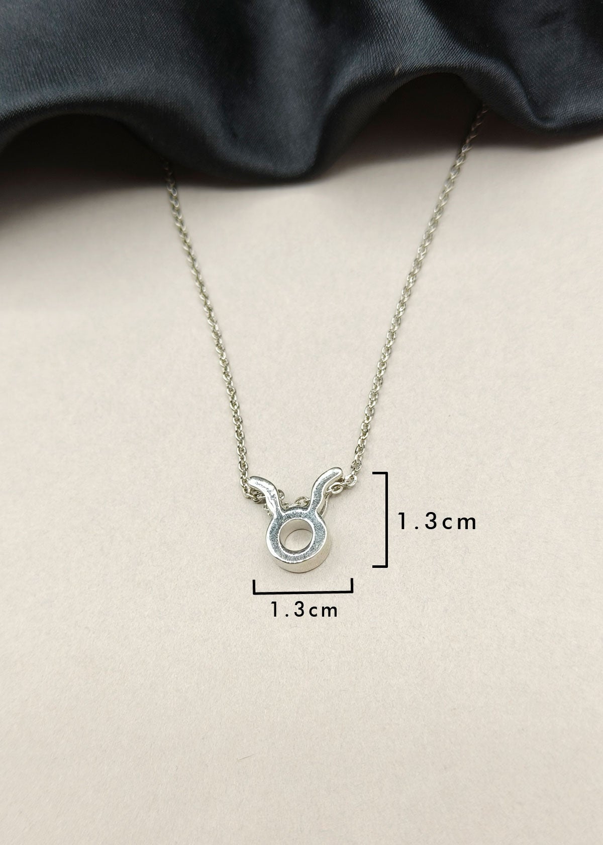 92.5 Sterling Silver Taurus Zodiac Symbol Pendant + Chain