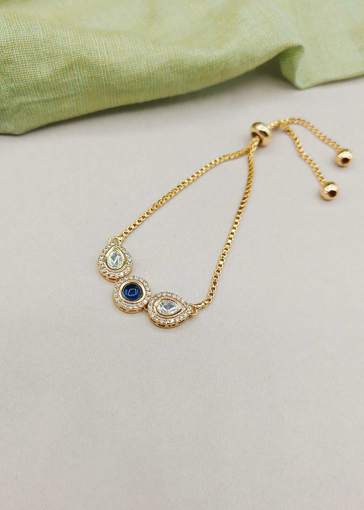 Sleek Trio Colorful Stone Kundan And Cubic Zircon Gold Polished Adjustable Slider Bracelet