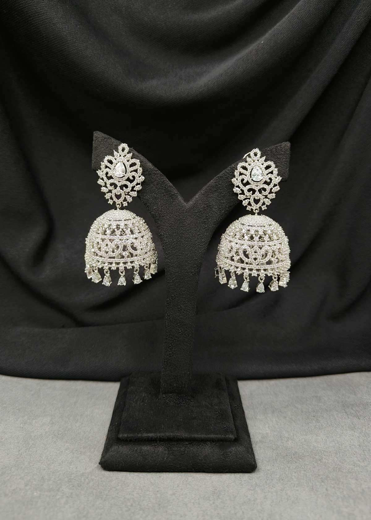Grand Cubic Zircon Silver Plated Jhumka Earrings With Tear Drop Droplets