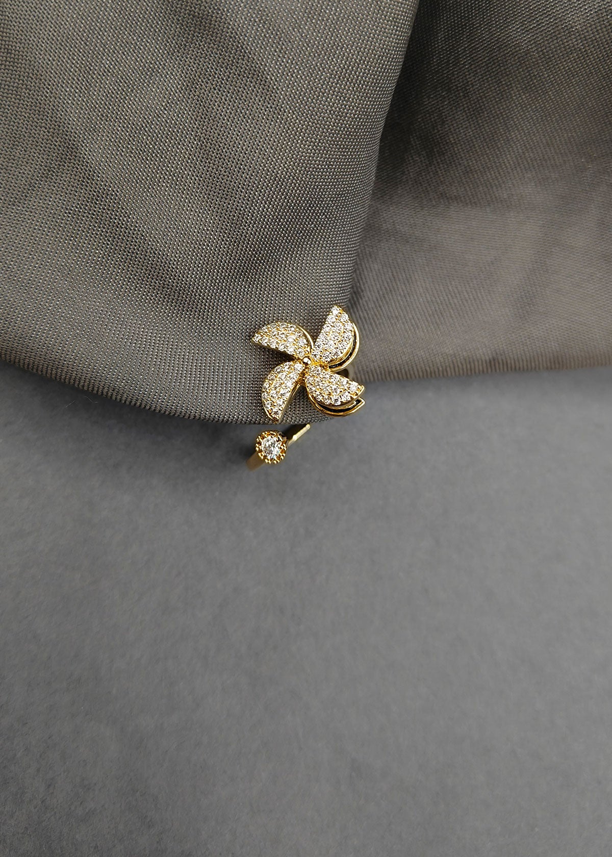 Cubic Zircon Four Petal Design Rotating Gold Plated Adjustable Finger Ring For Women