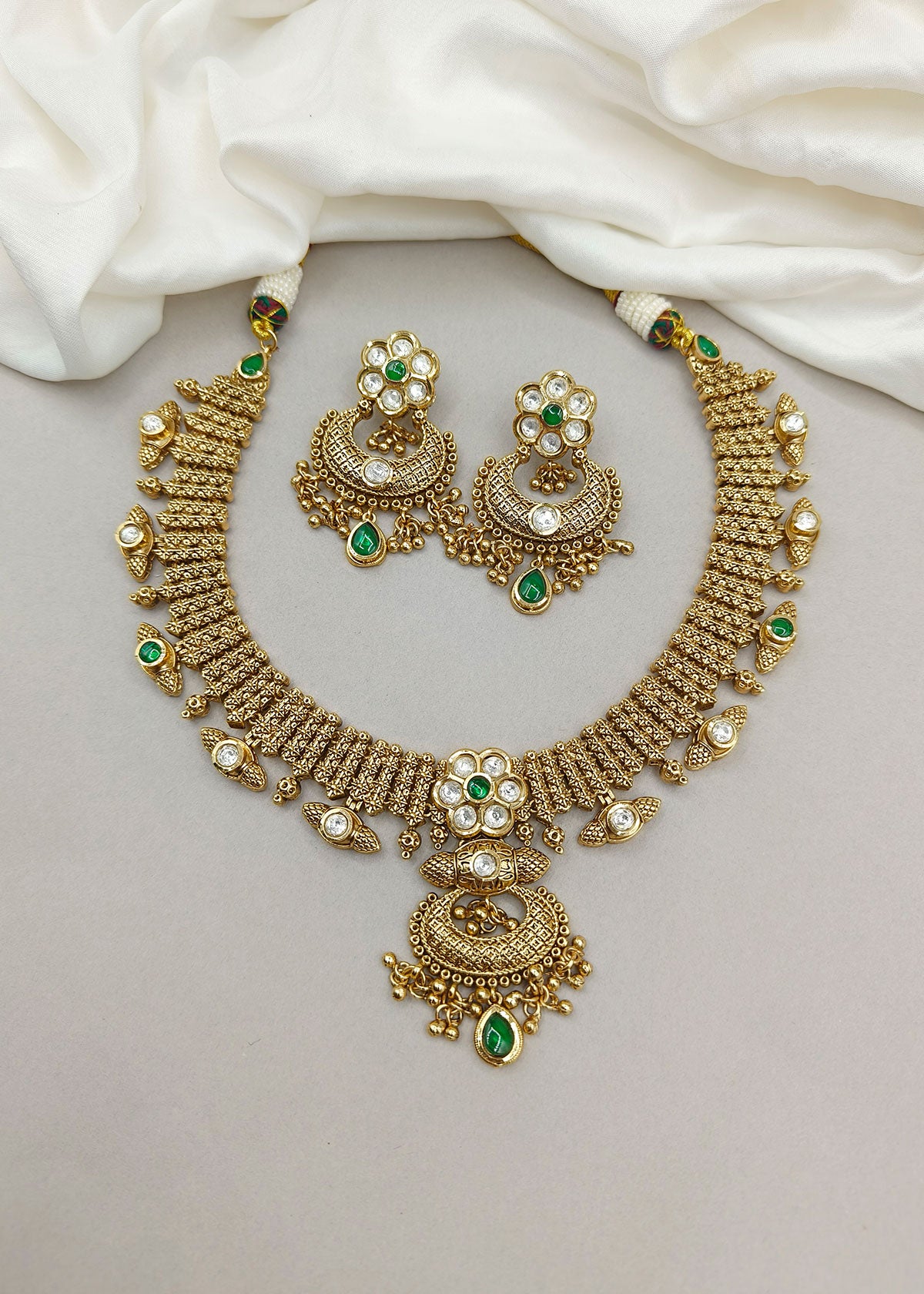 Traditional Kundan Floral Design Antique Gold Plated With Green Stone Temple Necklace Set