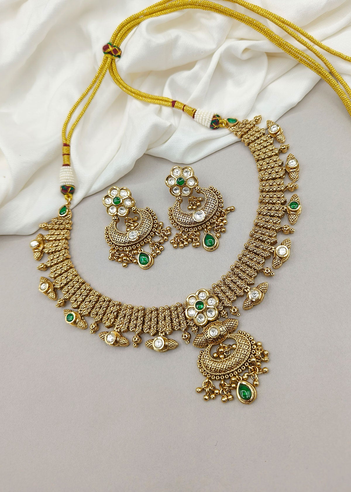 Traditional Kundan Floral Design Antique Gold Plated With Green Stone Temple Necklace Set