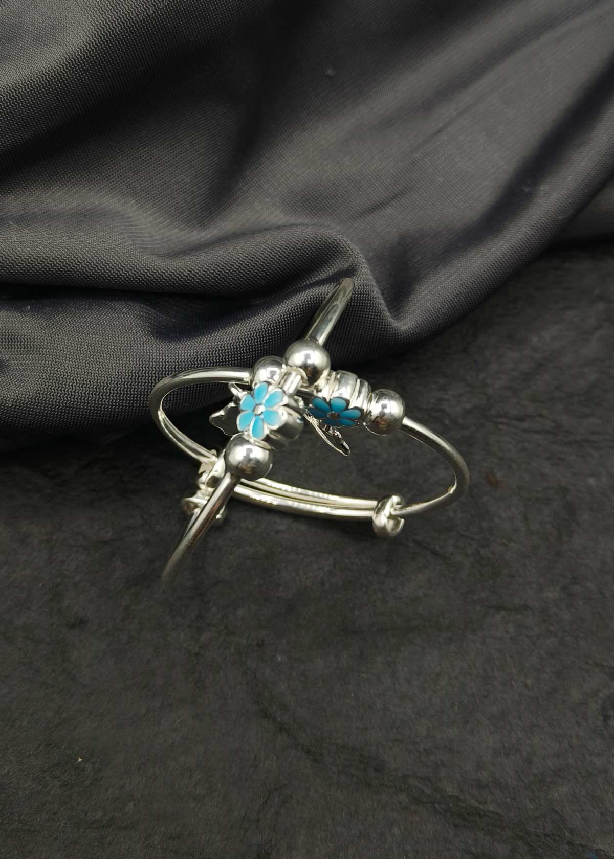 92.5 Sterling Silver Smiley Charm And Blue Meenakari Flower Adjustable Baby Kada