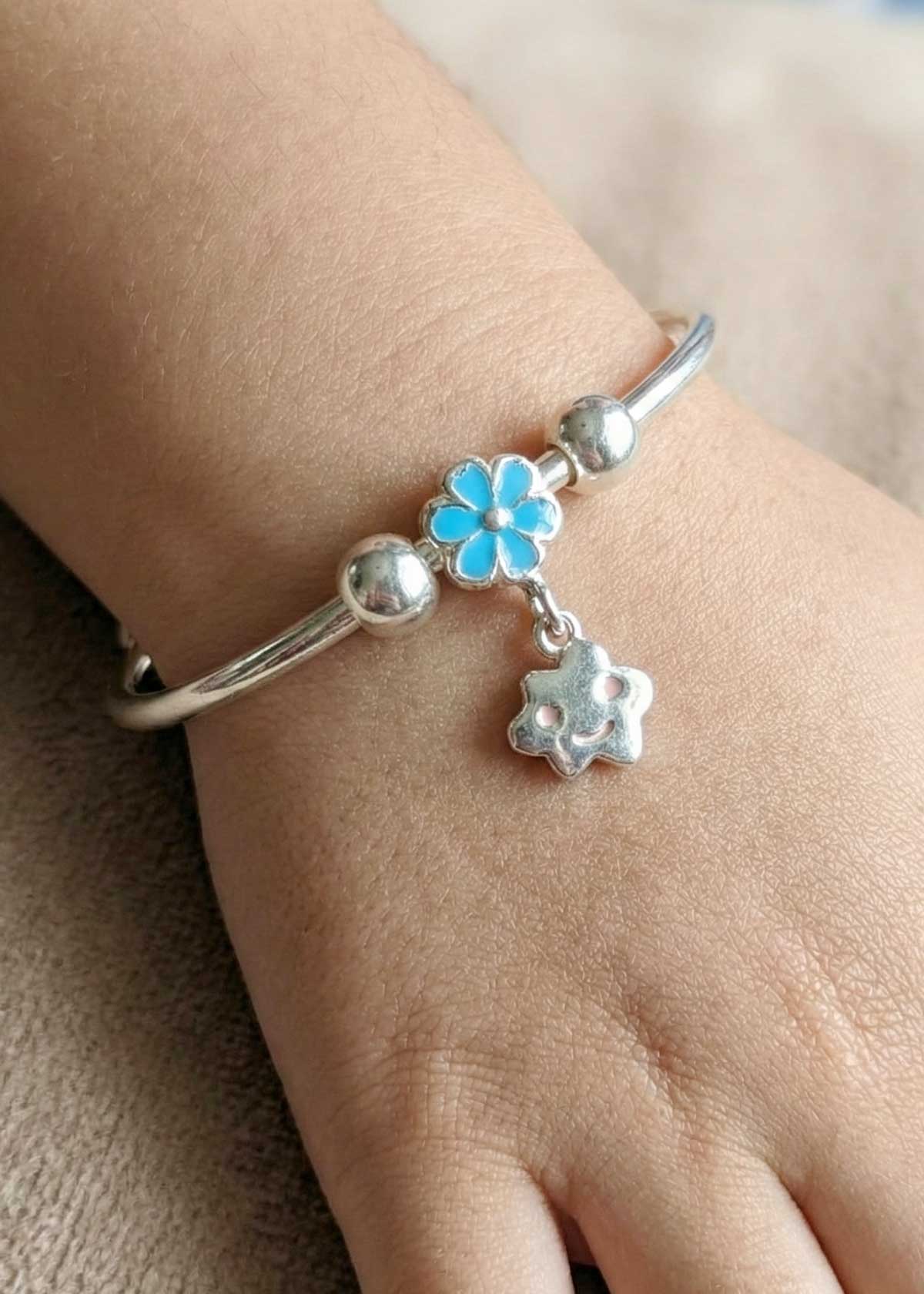 92.5 Sterling Silver Smiley Charm And Blue Meenakari Flower Adjustable Baby Kada