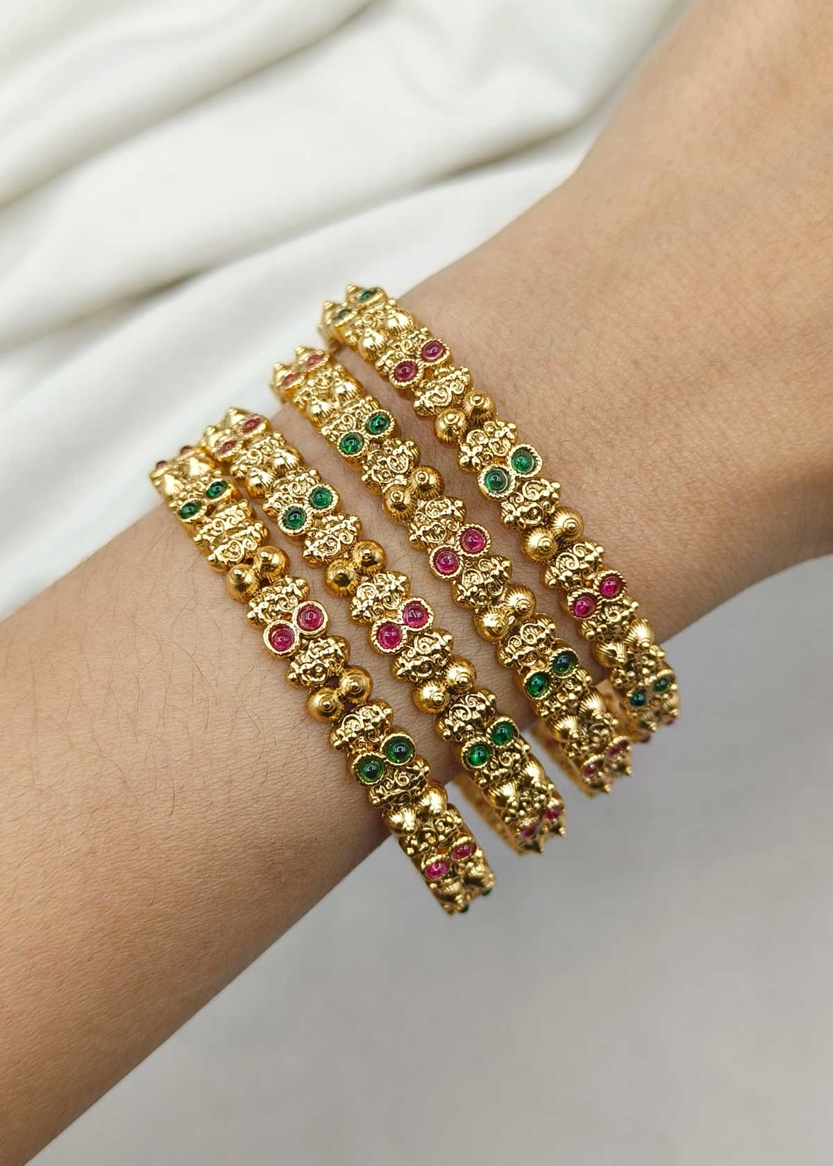 Vibrant Dual Tone Stone Studded Antique Gold Bangles (4 Pcs)