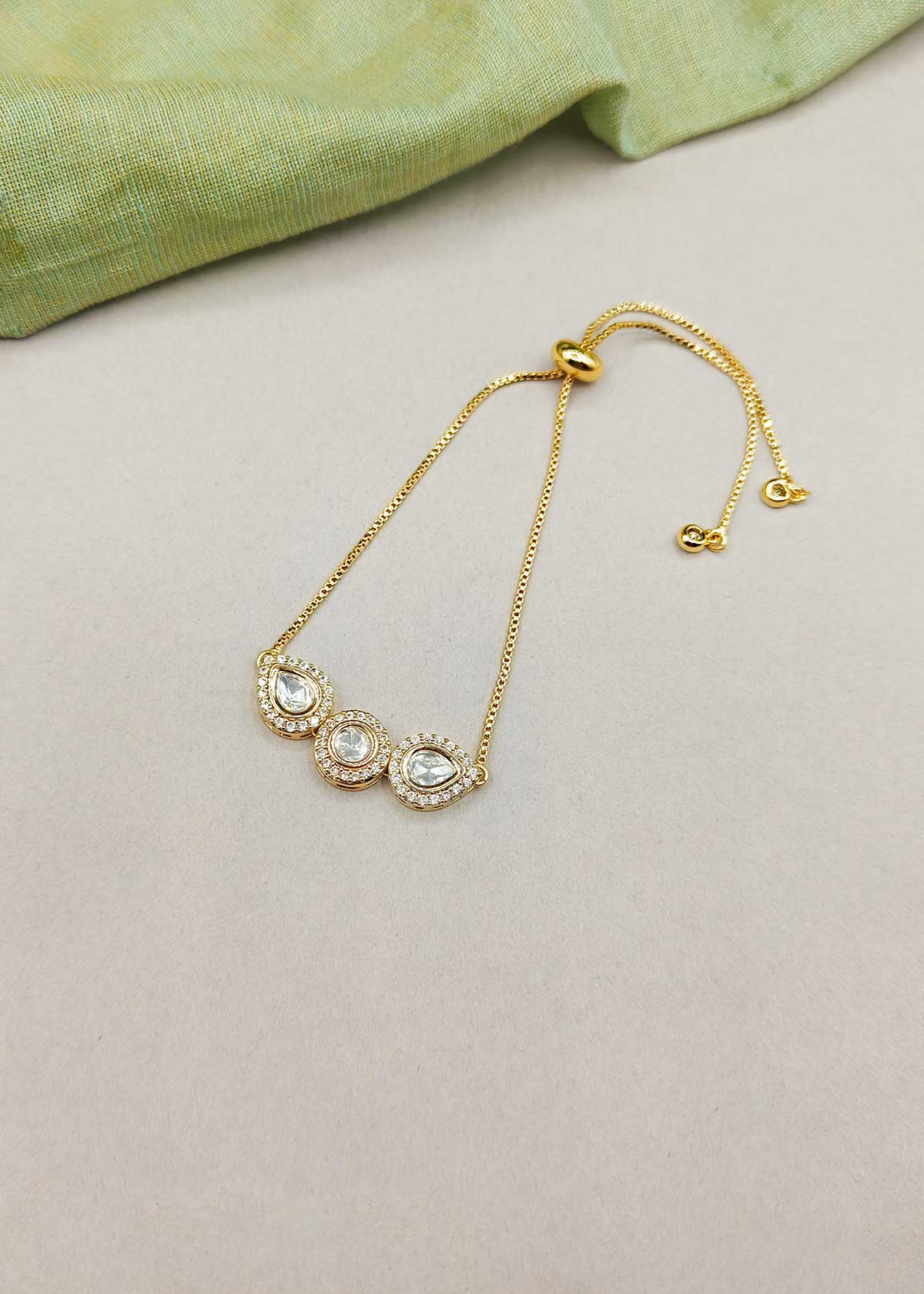 Sleek Trio Colorful Stone Kundan And Cubic Zircon Gold Polished Adjustable Slider Bracelet