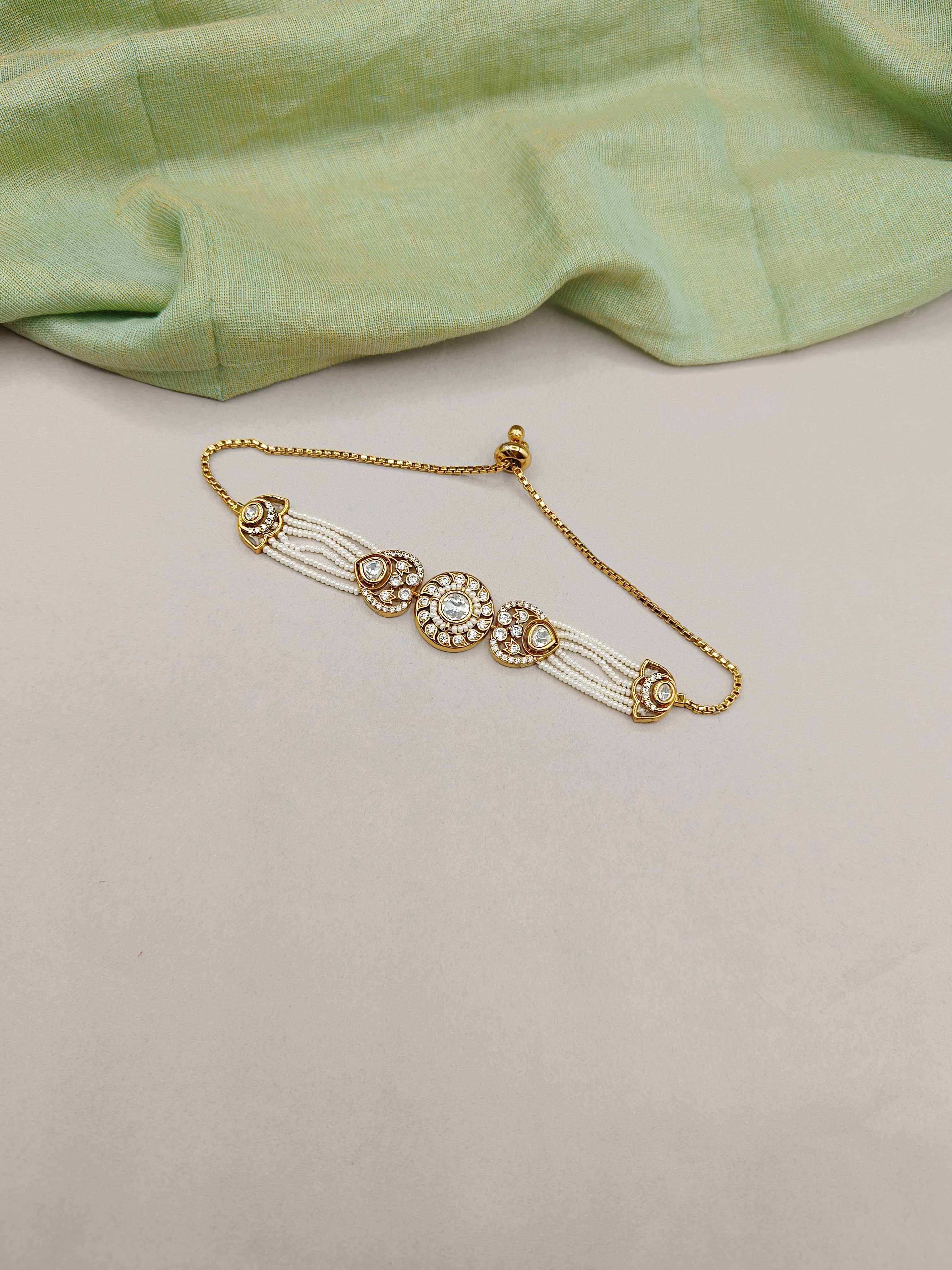 Beautiful Circular Style Cubic Zircon And Kundan Antique Gold Multi Strand Pearl Adjustable Slider Bracelet