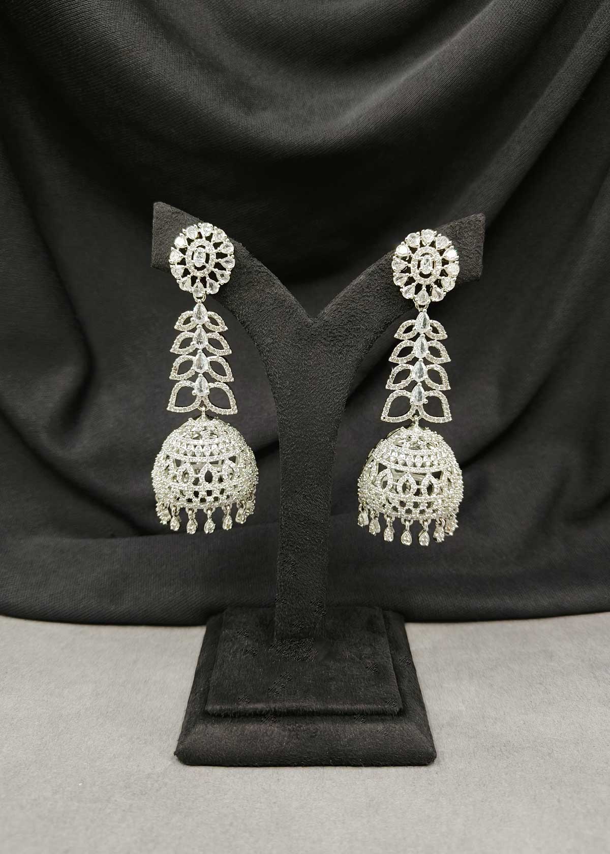 Elegant Silver Plated Cubic Zircon Long Jhumka Earrings With Floral Tear Drops