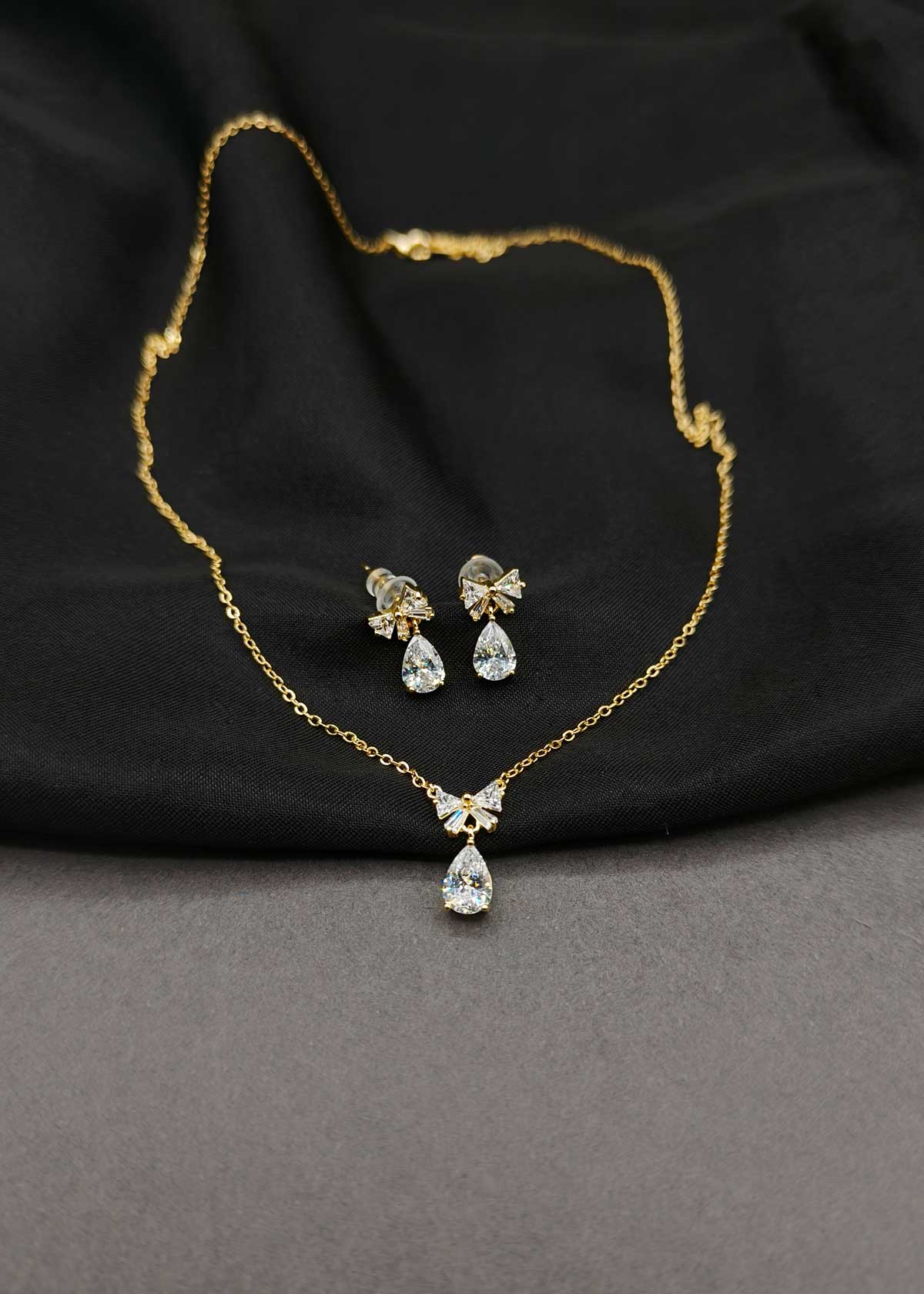Stunning Bow Style Baguette And Cubic Zircon Gold-Plated Pendant Set With Chain